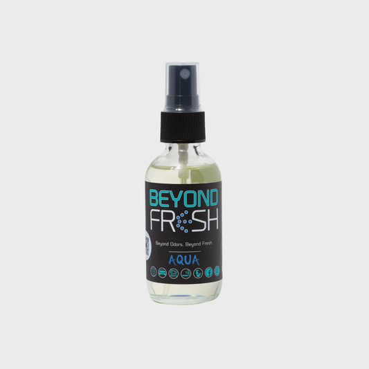 Bottle of 'Beyond Fresh' Aqua scented spray on a white background.