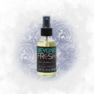 Bottle of 'Beyond Fresh' Black Frost scented spray with frozen elements on a white background.