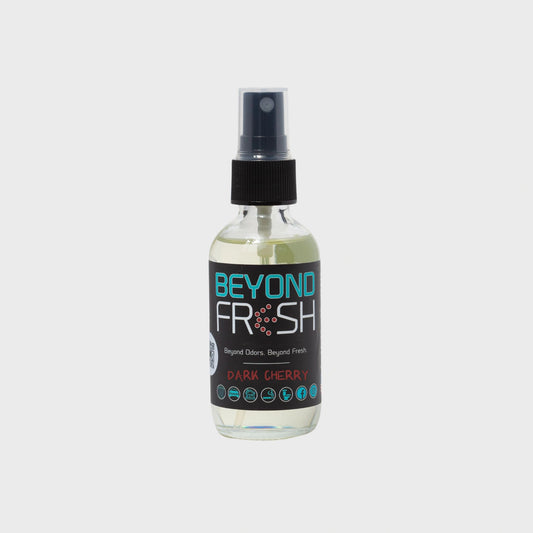 Bottle of 'Beyond Fresh' Dark Cherry scented spray on a white background.