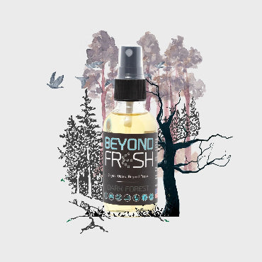 Bottle of 'Beyond Fresh' Dark Forest scented spray with a forest design on a white background.