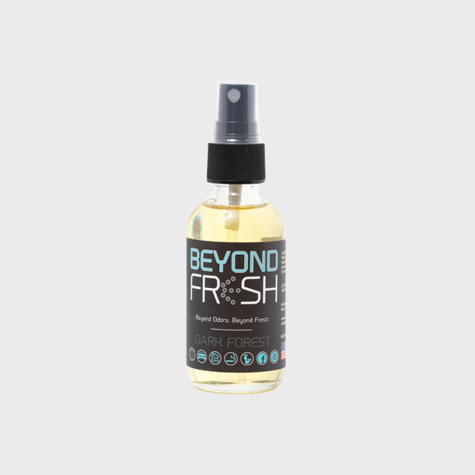 Bottle of 'Beyond Fresh' Dark Forest scented spray on a white background.
