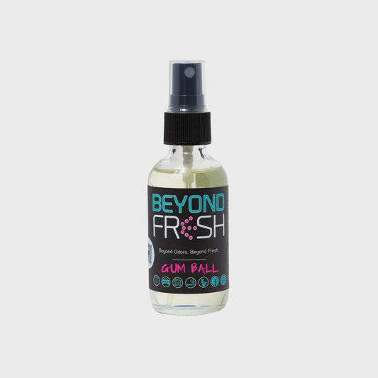 Bottle of 'Beyond Fresh' Gum Ball scented spray on a white background.