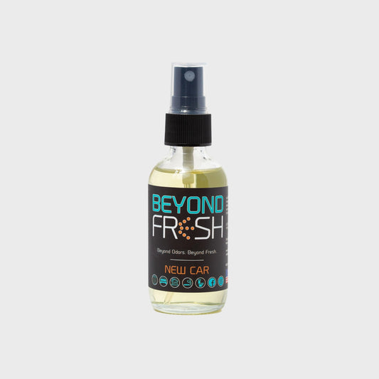 Bottle of 'Beyond Fresh' New Car scented spray on a white background.