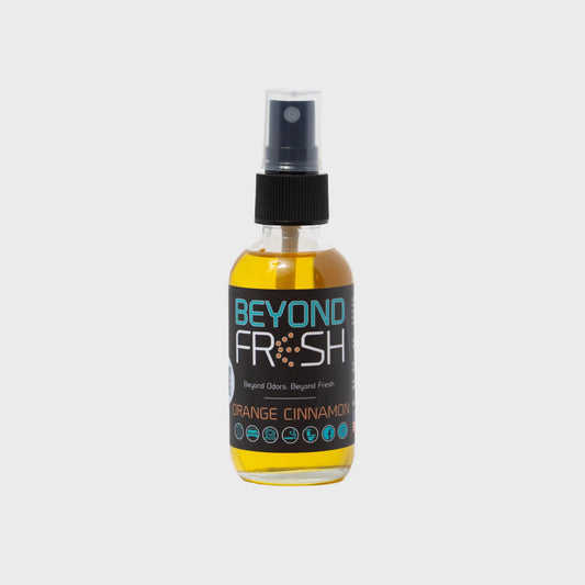 Bottle of 'Beyond Fresh' Orange Cinnamon scented spray with on a white background.