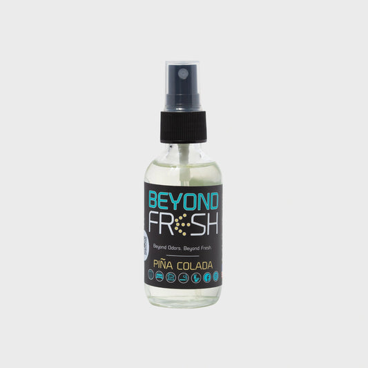 Bottle of 'Beyond Fresh' gum ball scented spray on a white background.
