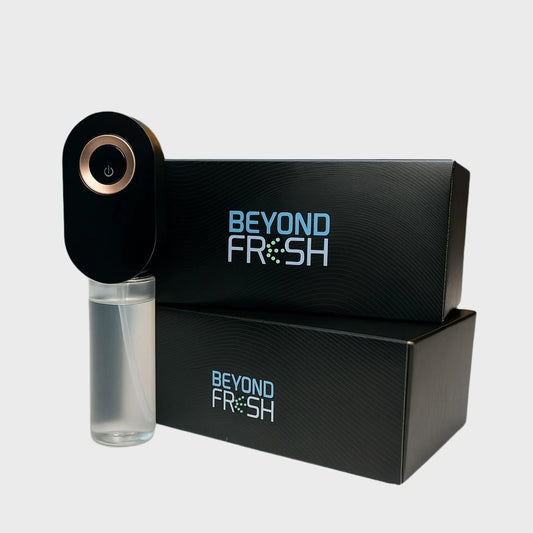 Black Plug-In Diffuser with packaging on the side on a white background.