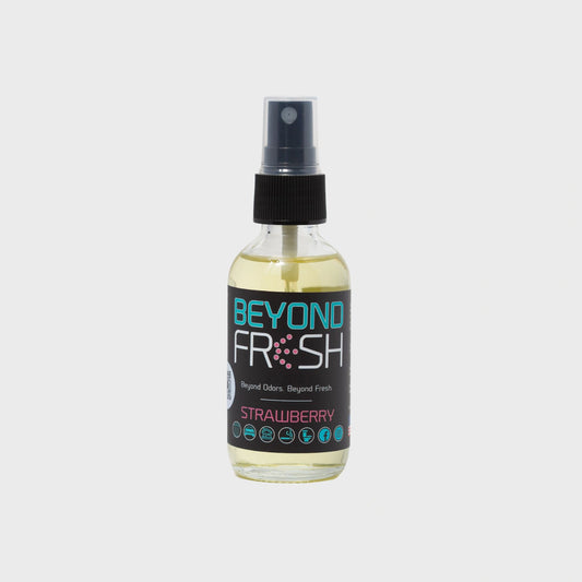 Bottle of 'Beyond Fresh' Strawberry scented spray on a white background.