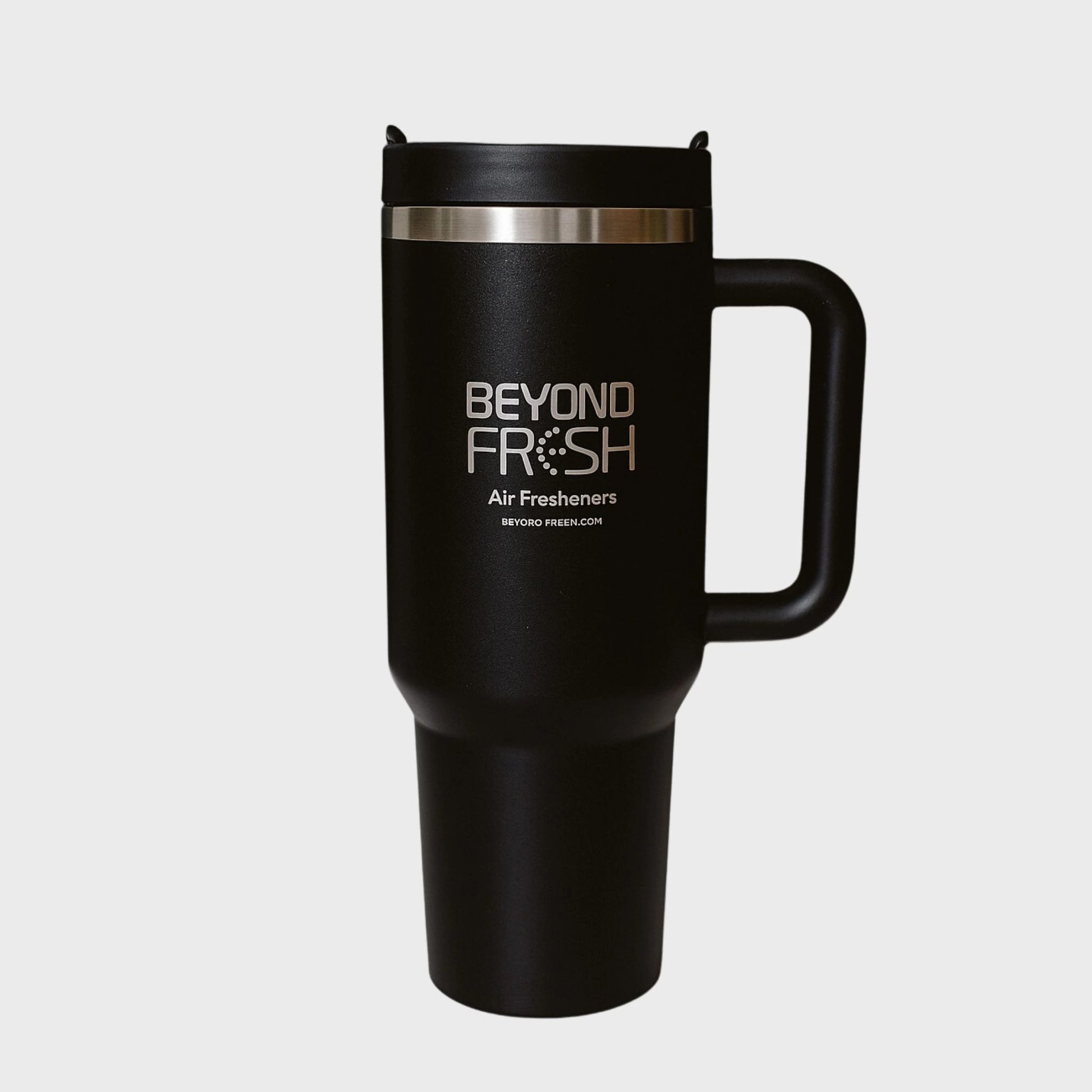 Front side of black stainless steel tumbler with silver laser engraved 'Beyond Fresh' branding on a white background.