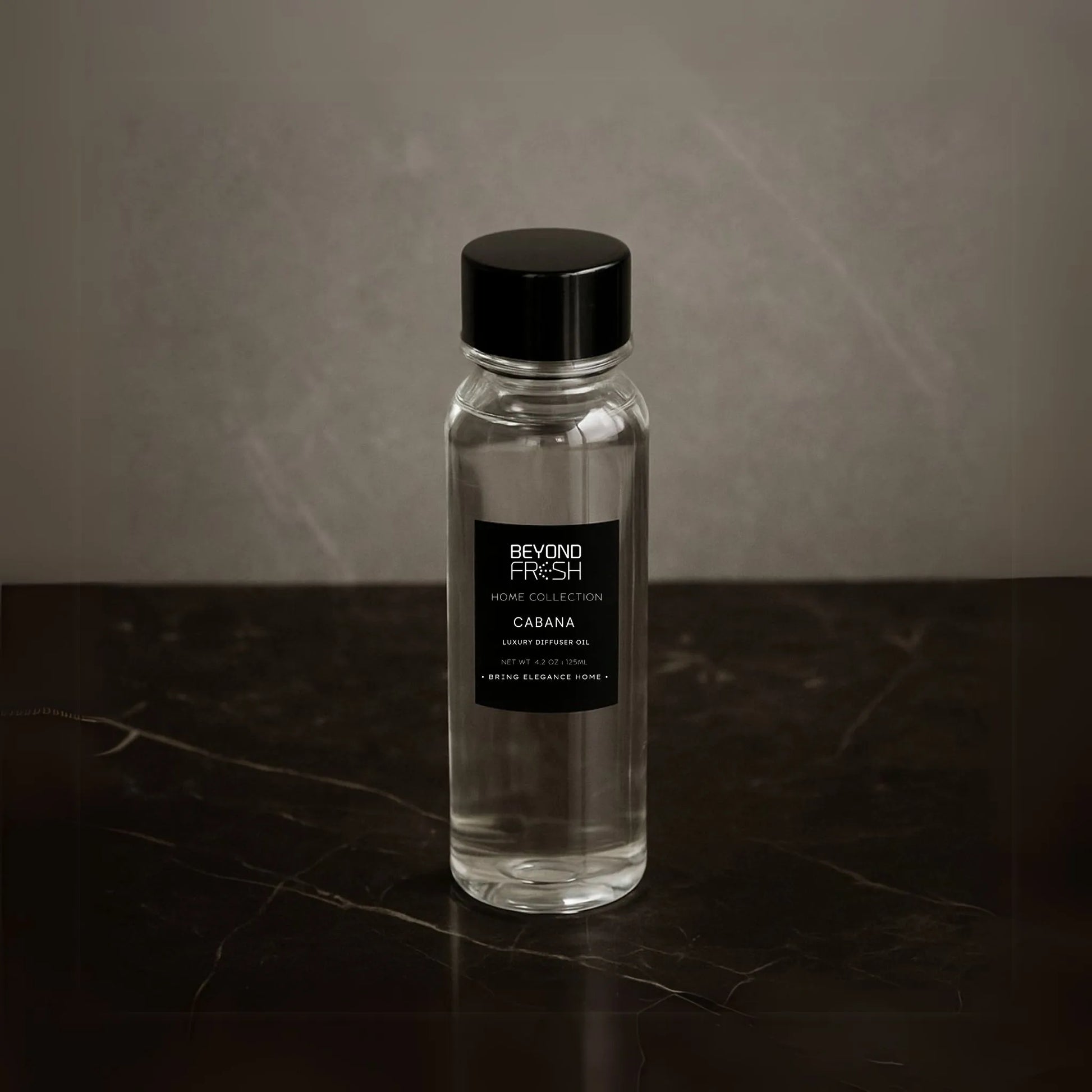 125 ml bottle of Home Collection Diffuser Oil Refill, Cabana Scent with a marble background.