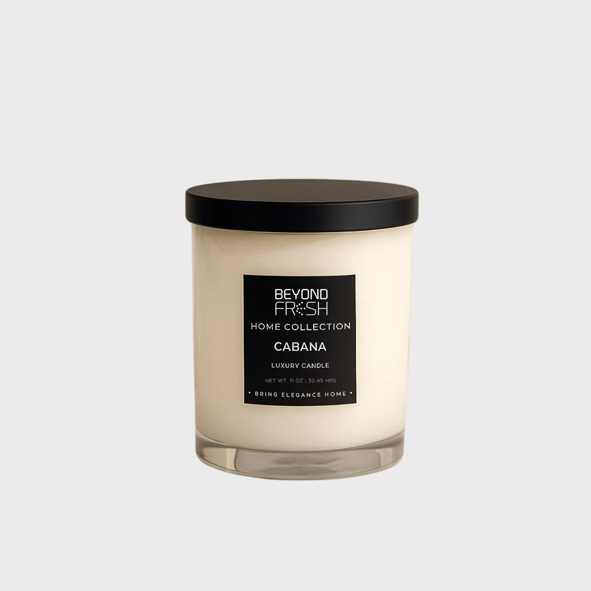 Candle with a black lid and label, Cabana scent on a white background
