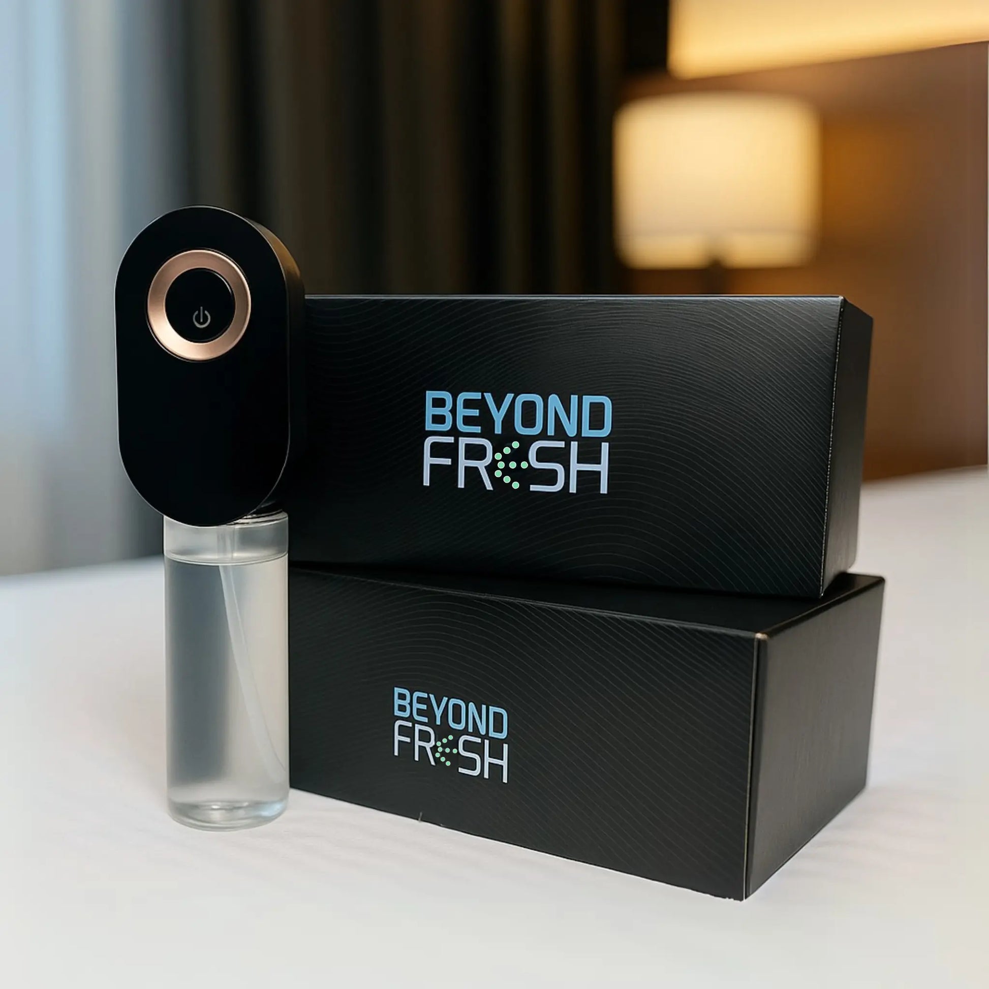 Black Beyond Fresh diffuser and bottle on a white surface with blurred background