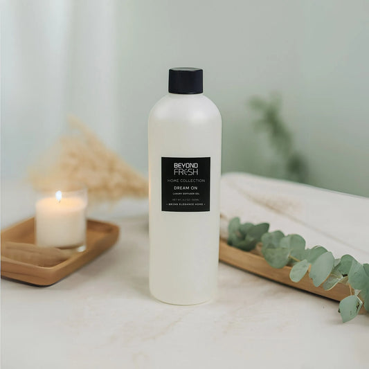 500 ml bottle of Home Collection Diffuser Oil Refill, Dream On Scent with a bathroom background