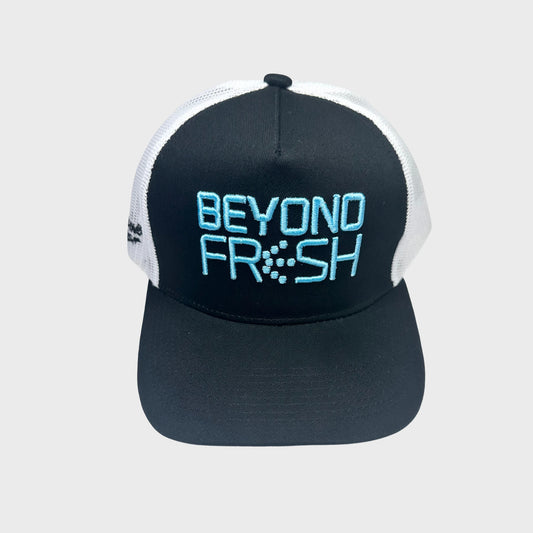 Black and white cap with Beyond Fresh text on a light gray background