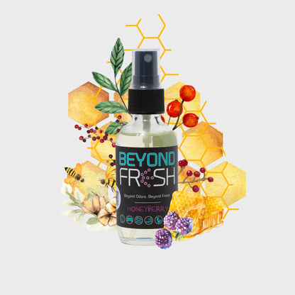 Bottle of 'Beyond Fresh' honeyberry spray with floral and honeycomb design elements on a light gray background.
