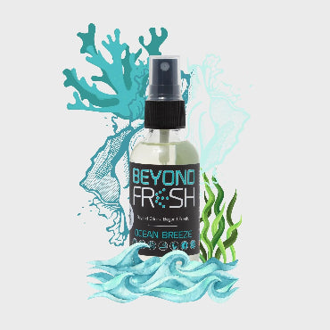Bottle of Ocean Breeze scented spray with ocean-themed design elements on white background.