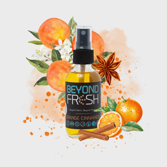 Bottle of Beyond Fresh Orange Cinnamon spray with orange and cinnamon elements on a light background