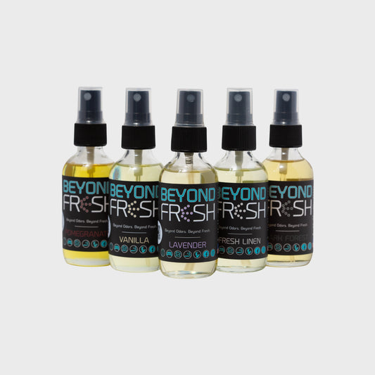 Five bottles of Beyond Fresh spray on a light gray background