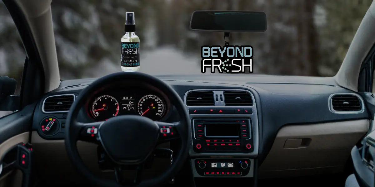 Car interior with a 'Beyond Fresh' spray bottle and hanging tag.